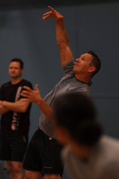 Tech. Sgt. Damion Heathcoat, member of the 319th Logistics Readiness Squadron, serves a volleyball to the opposing team during Summer Bash on Grand Forks Air Force Base Aug 18.  (U.S. Air Force photo by Senior Airman Amanda N. Stencil)