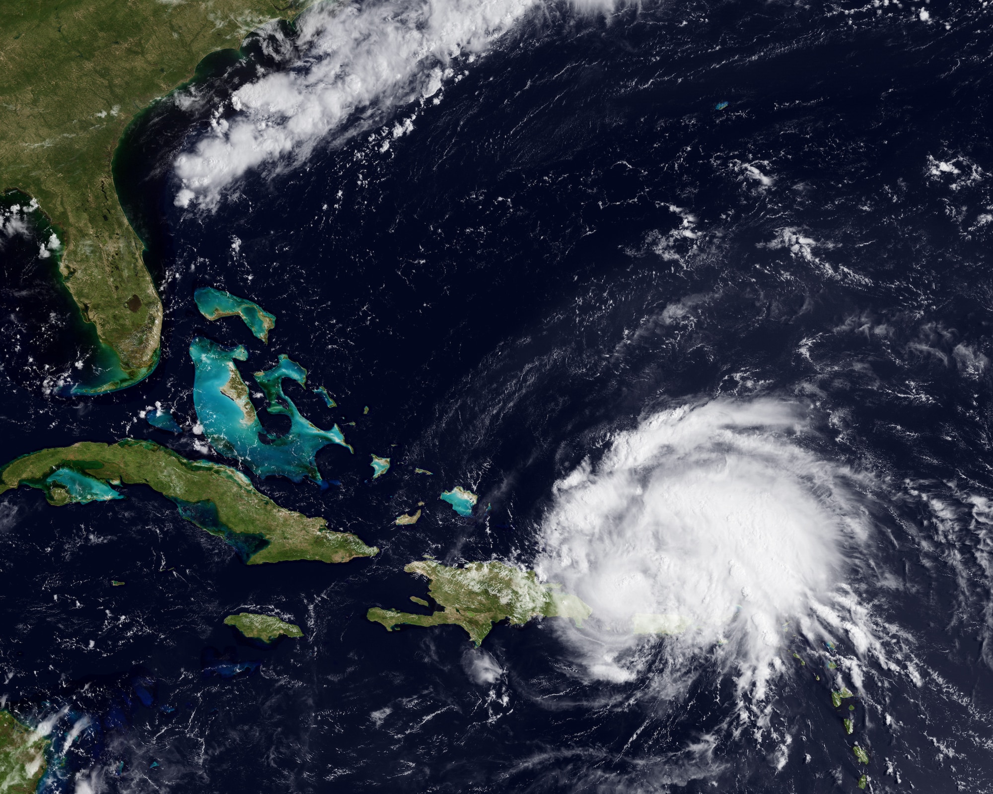 Hurricane eyes U.S. coastline 
Irene became the first hurricane of the 2011 Atlantic season this weekend. The storm, with 80 mph sustained winds, passed over Puerto Rico on Sunday, and is now on a path towards the Bahamas and Florida coastline. A ridge of high pressure to the north of the storm, around Bermuda, should stay in place over the next few days, forcing the storm along a west-northwest path. This image from the GOES-East satellite shows the storm on August 22, 2011 at 1345z.  
