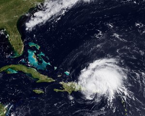Hurricane eyes U.S. coastline 
Irene became the first hurricane of the 2011 Atlantic season this weekend. The storm, with 80 mph sustained winds, passed over Puerto Rico on Sunday, and is now on a path towards the Bahamas and Florida coastline. A ridge of high pressure to the north of the storm, around Bermuda, should stay in place over the next few days, forcing the storm along a west-northwest path. This image from the GOES-East satellite shows the storm on August 22, 2011 at 1345z.  
