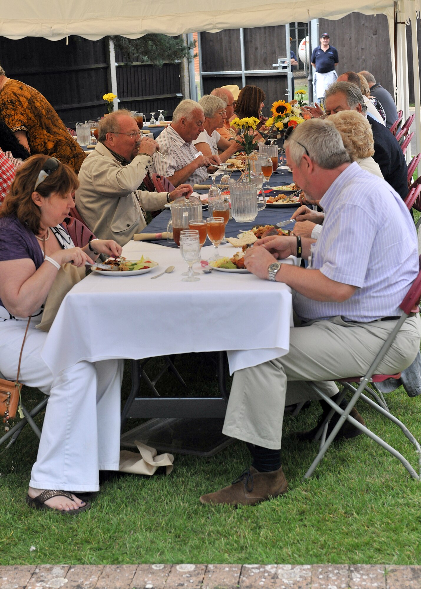 RAF MILDENHALL, England – Base members and local British community leadership enjoy a Tex-Mex style lunch at the New Mayor’s Barbecue here Aug. 20, 2011.  The event began with a mission brief, followed by a line dancing demonstration and concluded with lunch. (U.S. Air Force photo/Staff Sgt. Tabitha M. Lee)