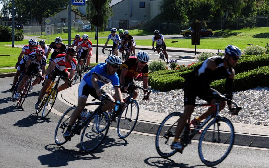 SPANGDAHLEM AIR BASE, Germany – Service members circle through a roundabout during the annual United States Armed Forces in Europe classic bike race here Aug. 20. Krista Jones from Spangdahlem Air Base won the women’s 30-kilometer road race with a time of 1:03:49. Christopher Lulei, from Ramstein Air Base, Germany, won the men’s 50-kilometer road race with a time of 1:18:47. Twenty-six cyclists from nine different military installations participated in the road race. (U.S. Air Force photo/Airman 1st Class Matthew B. Fredericks)