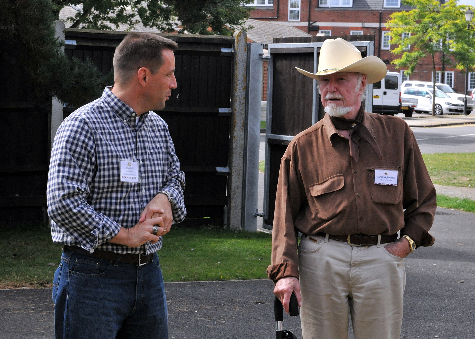 RAF MILDENHALL, England -- Col. Christopher Kulas, 100th Air Refueling Wing commander, speaks with Councillor Derek Montimer, Mayor of Thetford, during the New Mayor’s Barbecue here Aug. 20, 2011.  During this event, British community leaders were educated on the base’s mission to further their understanding of what happens here on a daily basis.  (U.S. Air Force photo/Staff Sgt. Tabitha M. Lee)