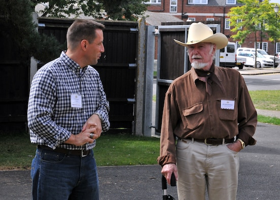 RAF MILDENHALL, England -- Col. Christopher Kulas, 100th Air Refueling Wing commander, speaks with Councillor Derek Montimer, Mayor of Thetford, during the New Mayor’s Barbecue here Aug. 20, 2011.  During this event, British community leaders were educated on the base’s mission to further their understanding of what happens here on a daily basis.  (U.S. Air Force photo/Staff Sgt. Tabitha M. Lee)
