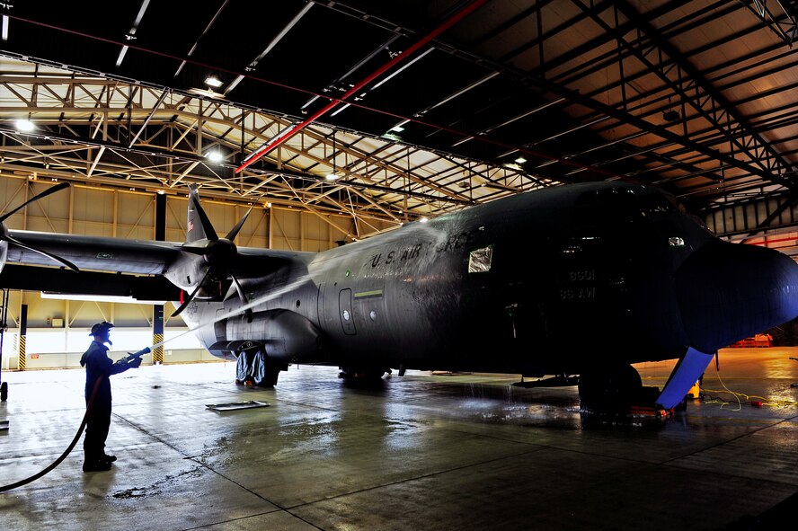 U.S. Air Force Airman 1st Class Richard Tuttle, maintainer, 86th Maintenance Squadron air and ground equipment, rinses a C-130J Super Hercules during a scheduled wash, Ramstein Air Base, Germany, Aug. 22, 2011. The three day process prepared the aircraft for a C-1 inspection; a detailed examination which requires the aircraft to undergo a more in-depth cleaning process. (U.S. Air Force photo by Airman Brea Miller)
