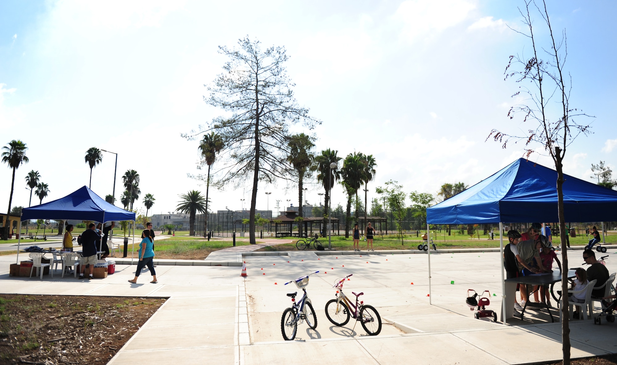 Airmen and their families gather at Eagle Housing's park for a Bicycle Safety Rodeo Aug. 20, 2011, at Incirlik Air Base, Turkey. The annual event is designed to inform riders of all ages about proper safety techniques to use while riding a bicycle. (U.S. Air Force photo by Senior Airman Anthony Sanchelli/Released) 