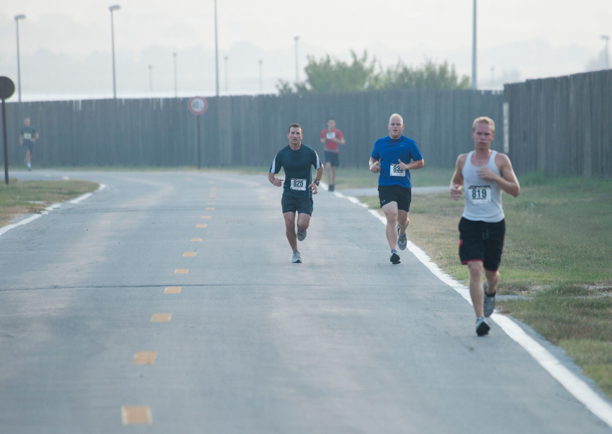 Participants race during the five-kilometer run portion of the 3rd Annual Sprint Triathlon Aug. 20, 2011, at Incirlik Air Base, Turkey. The triathlon also included a 20-kilometer bike ride and a 225-meter swim.(U.S. Air Force photo by Airman 1st Class Clayton Lenhardt/Released)