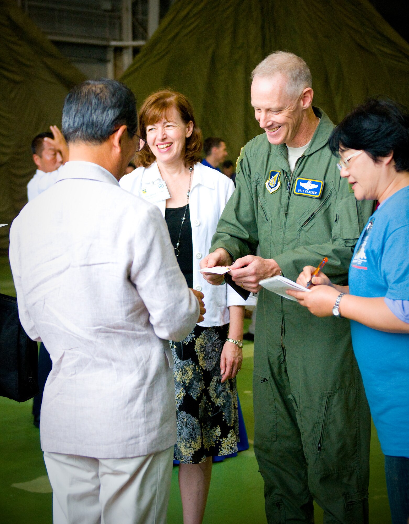 YOKOTA AIR BASE, Japan -- Col. Otto Feather, 374th Airlift Wing commander, greets a distinguished Japanese visitor during a luncheon held at the Japanese-American Friendship Festival at Yokota Air Base, Japan, Aug. 21, 2011. The 374th AW hosted the luncheon to give base leadership a chance to personally thank local dignitaries and reinforce good relations with the local community. (U.S. Air Force photo/Airman 1st Class Krystal M. Garrett) 