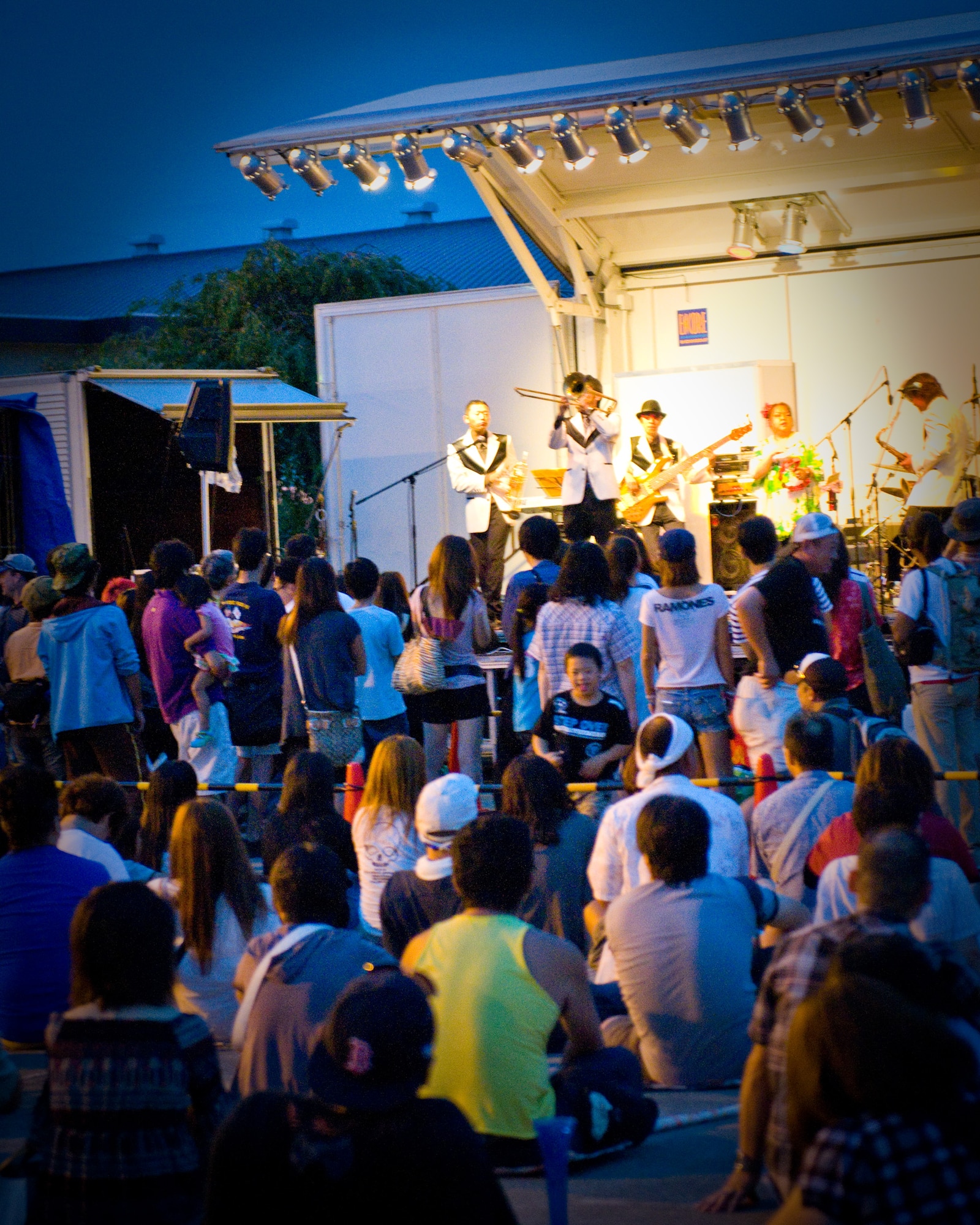 YOKOTA AIR BASE, Japan -- A Japanese band entertains a crowd during the Japanese-American Friendship Festival held at Yokota Air Base, Japan, Aug. 20, 2011. Live musical performances were one of the many attractions for approximately 117,000 visitors who attended the festival. (U.S. Air Force photo/Airman 1st Class Krystal M. Garrett)