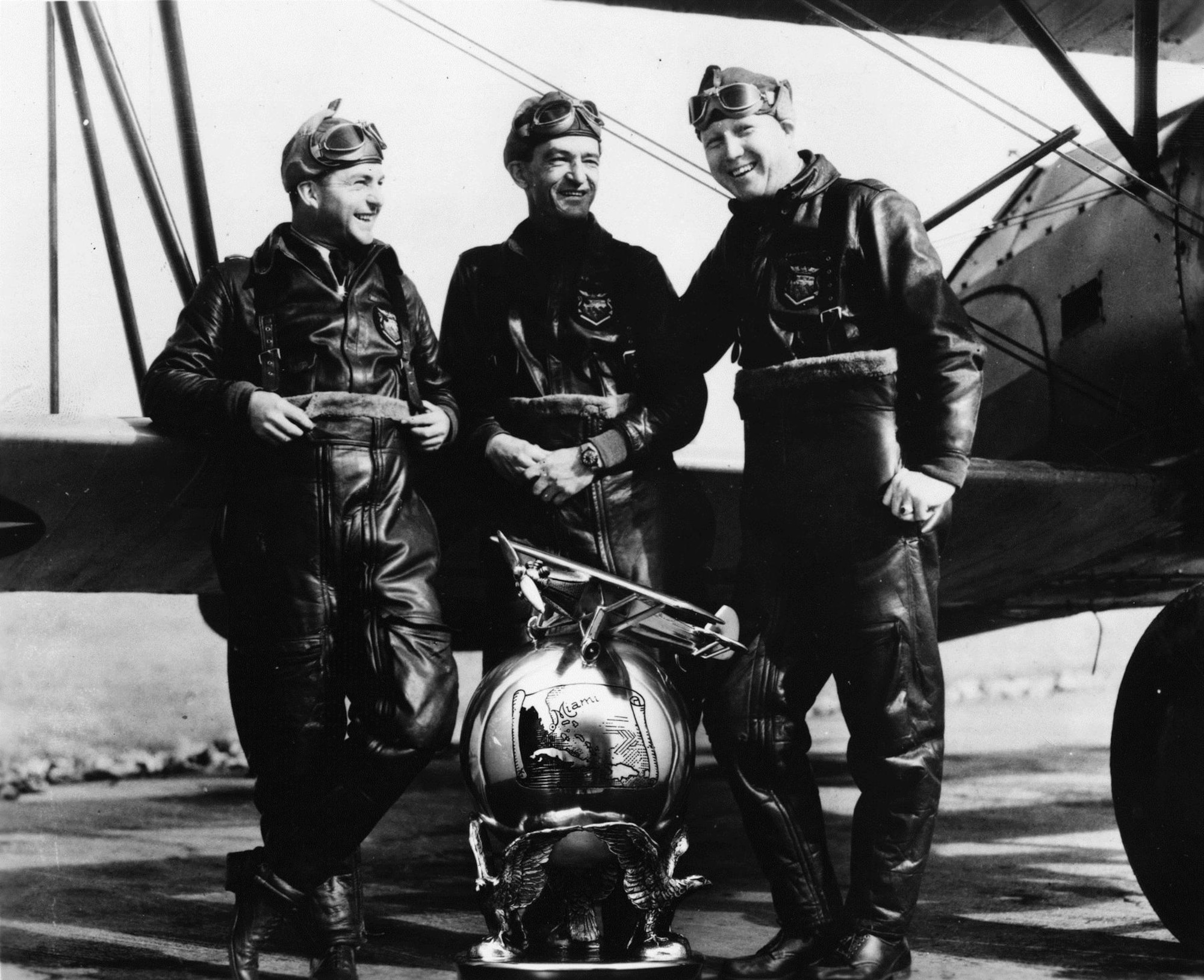 Men on the Flying Trapeze, an Army flight demonstration team organized by then-Capt. Claire Chennault in 1932, at one time included two enlisted pilots who continued to serve after their release from active duty as reserve officers. From left are Sgt. William C. McDonald, Capt. Chennault and Sgt. John H. Williamson. Later, each helped train China's air force prior to World War II. SSgt. Ray Clinton also flew solo stunt and backup for the team. (U.S. Air Force photo)