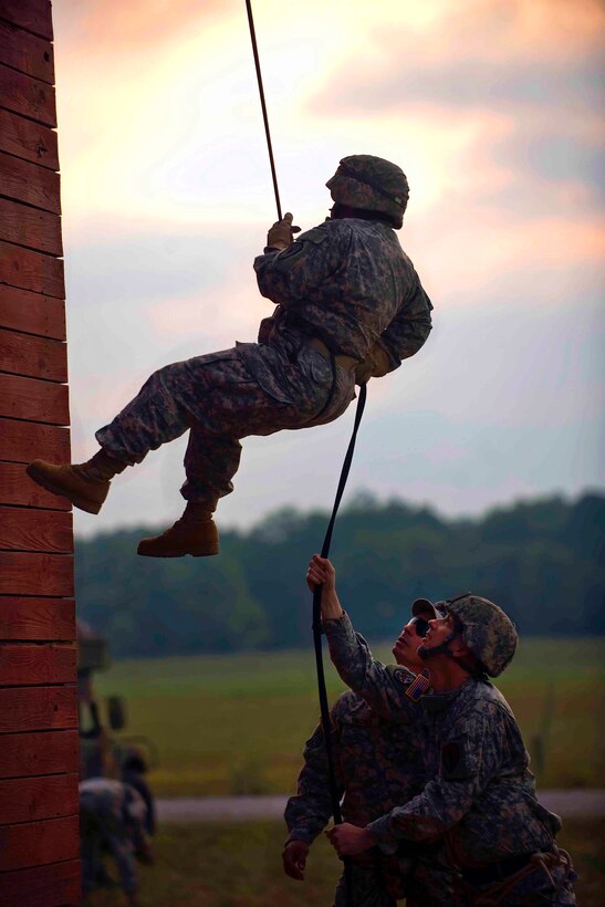 Army Sgt. Lasima Packett rappels down the rappel tower at the Joint Maneuver Training Center on Camp Atterbury, Ind., Aug. 18, 2011. Packett is assigned to the Indiana National Guard's 81st Troop Command.
