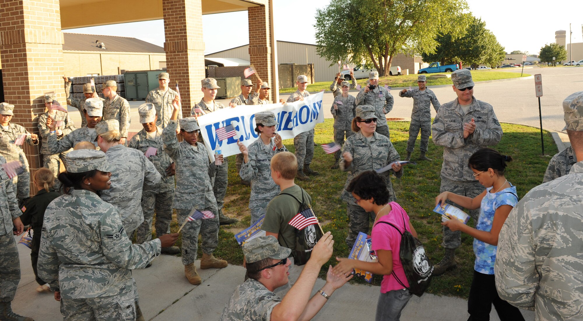Shaw Air Force Base Airmen welcome back the children participating in the annual Operation Take-Flight at the deployment processing center at Shaw Air Force Base, S.C. Aug. 24, 2011. Operation Take-Flight gives children a chance to experience what proceses their parents go through prior to deployments. (U.S. Air Force photo/Airman 1st Class Tabatha L. Duarte)(Released)
