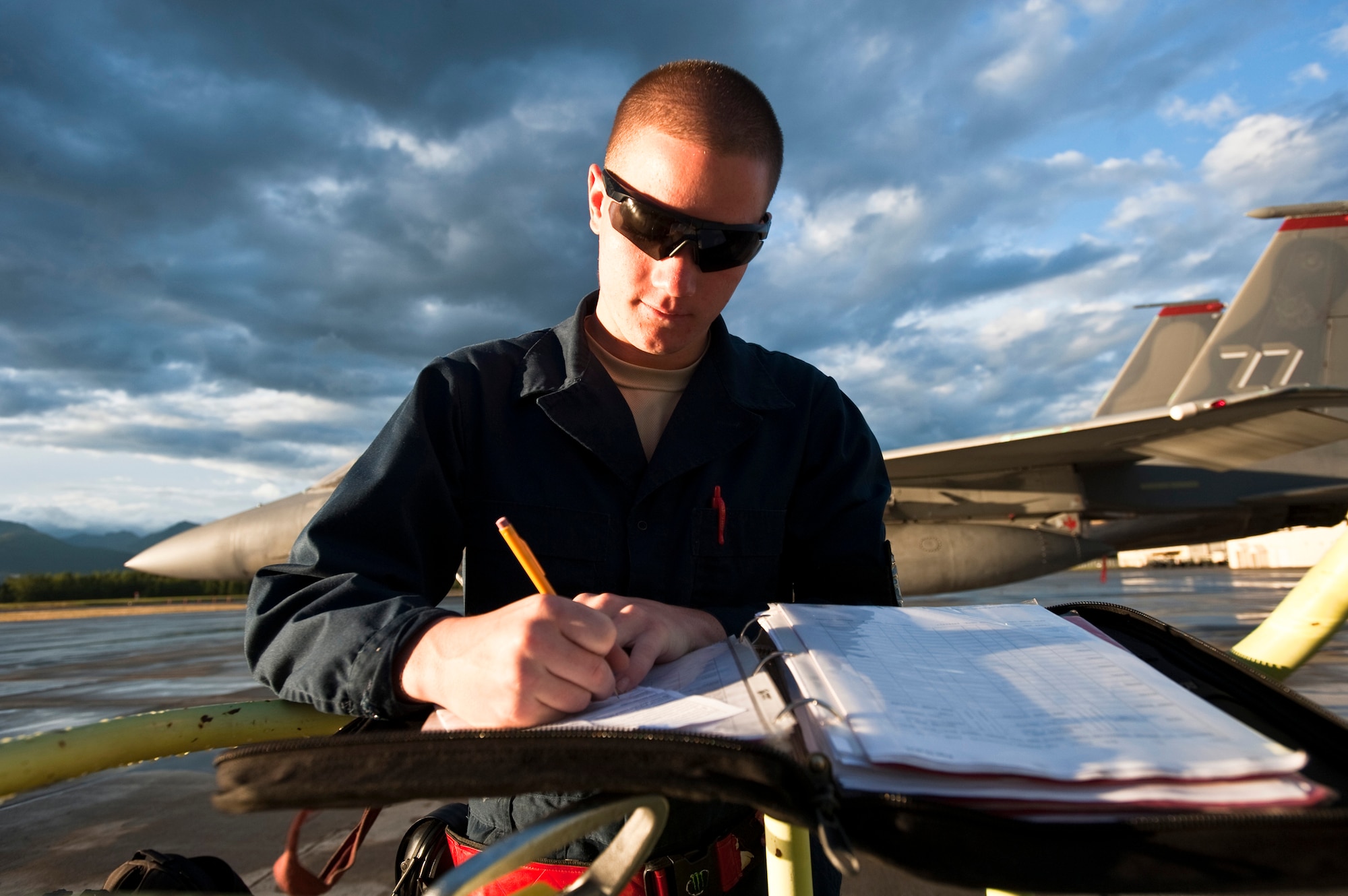 JOINT BASE ELMENDORF-RICHARDSON, Alaska -- Airman 1st Class Michael Atherton, 18th Aircraft Maintenance Squadron, goes through his pre-flight inspection of an F-15 Eagle Aug. 18. Atherton and about 150 other Airmen from Kadena Air Base, Okinawa, Japan, arrived at JBER earlier this month to participate in Red-Flag Alaska 11-3 which runs from Aug. 15 through 26. (U.S. Air Force photo/Senior Airman Christopher Gross)