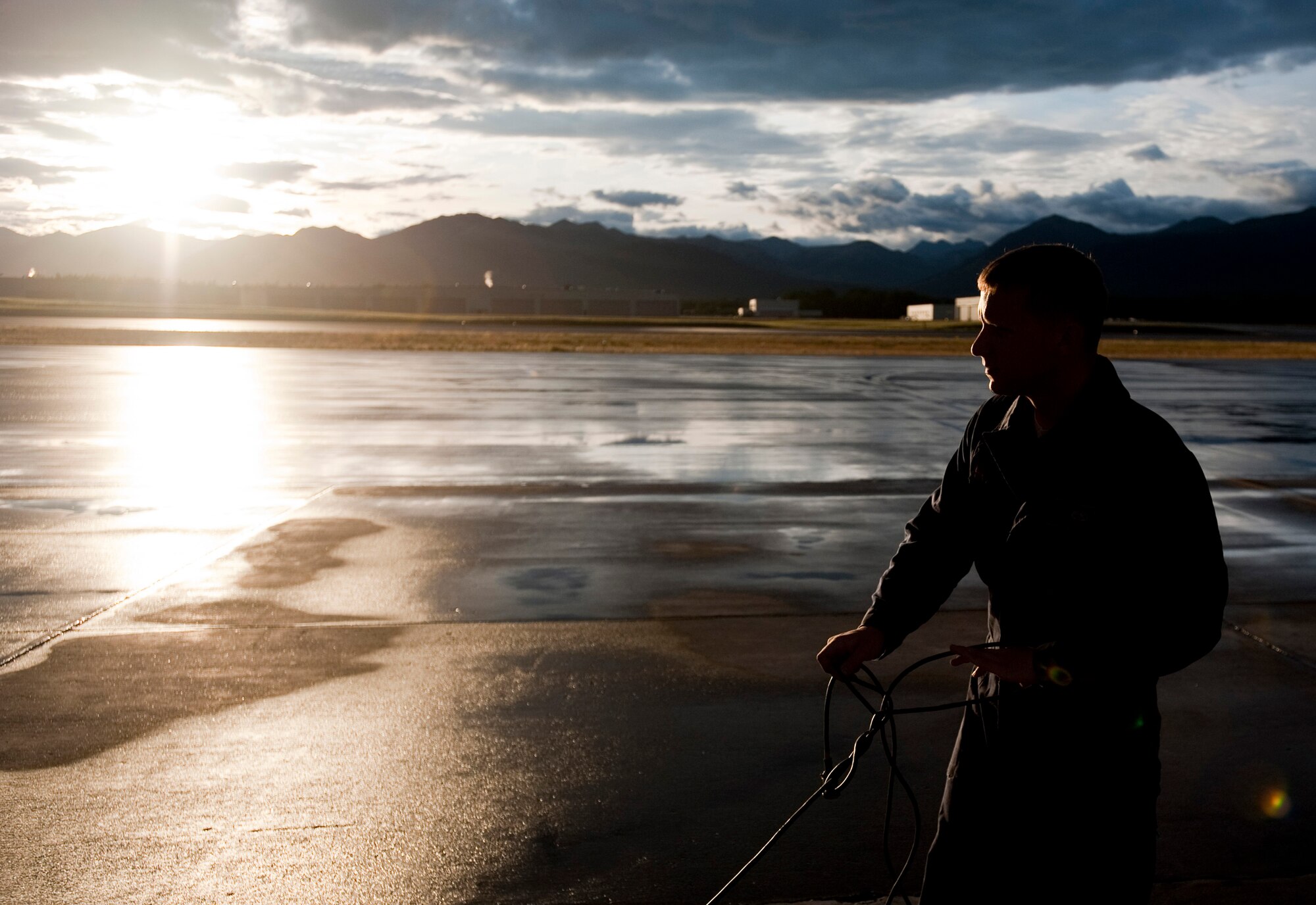 JOINT BASE ELMENDORF-RICHARDSON, Alaska -- Airman 1st Class William Denton, 18th Aircraft Maintenance Squadron, pulls cord from a box while he does his pre-flight inspection of an F-15 Eagle Aug. 18. Denton and about 150 other Airmen from Kadena Air Base, Okinawa, Japan, arrived at JBER earlier this month to participate in Red-Flag Alaska 11-3 which runs from Aug. 15 through 26. (U.S. Air Force photo/Senior Airman Christopher Gross)