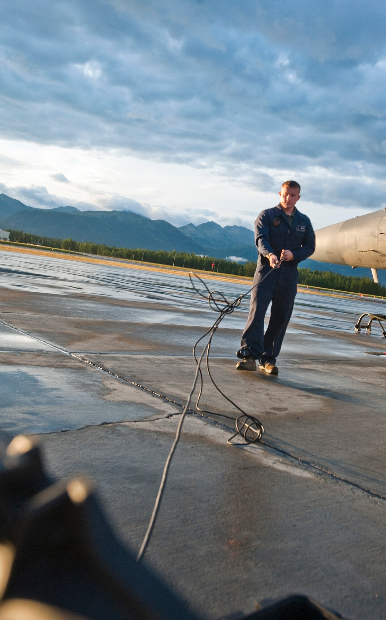 JOINT BASE ELMENDORF-RICHARDSON, Alaska -- Airman 1st Class William Denton, 18th Aircraft Maintenance Squadron, pulls cord from a box while he does his pre-flight inspection of an F-15 Eagle Aug. 18. Denton and about 150 other Airmen from Kadena Air Base, Okinawa, Japan, arrived at JBER earlier this month to participate in Red-Flag Alaska 11-3 which runs from Aug. 15 through 26. (U.S. Air Force photo/Senior Airman Christopher Gross)