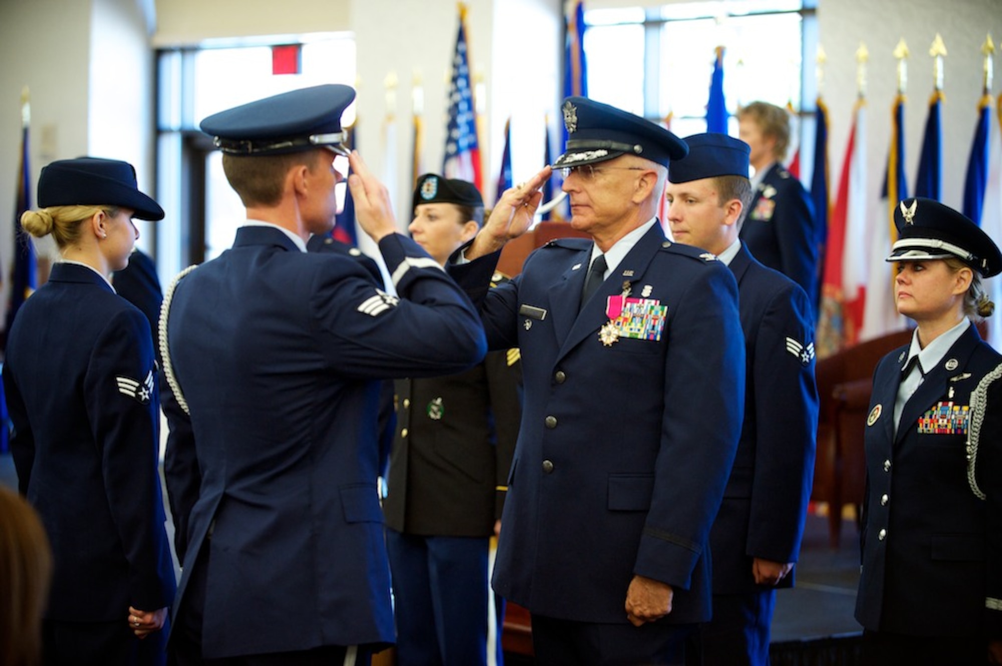 Col. James T. Patterson returns a salute from the honor guard during his retirement ceremony held Aug. 21 at the Scott Club. Colonel Patterson has been part of the 932nd Airlift Wing, Air Force Reserve, since 2003. He served as 932nd Aeromedical Staging Squadron commander from 2003 to 2008. Colonel Patterson was  932nd Medical Group commander from January 2008 to June 2011. (U.S. Air Force photo by Tech. Sgt. Christopher Parr) 
