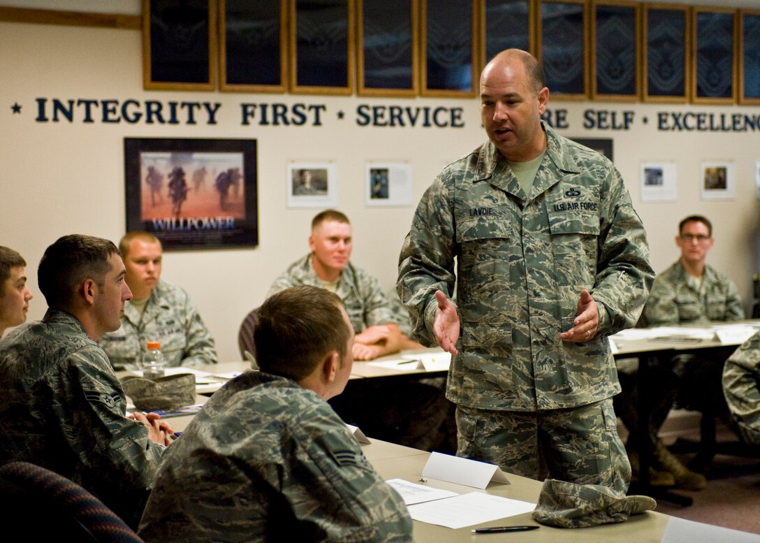 Command Chief Master Sgt. Brian Lavoie, 28th Bomb Wing command chief, speaks to a group of Airmen attending the Professional Airmen Seminar at Ellsworth Air Force Base, S.D., Aug. 16, 2011. Chief Lavoie gave the Airmen the introduction briefing of the three-day course designed to help Airmen develop leadership skills. (U.S. Air Force photo/Airman Alystria Maurer/Released)