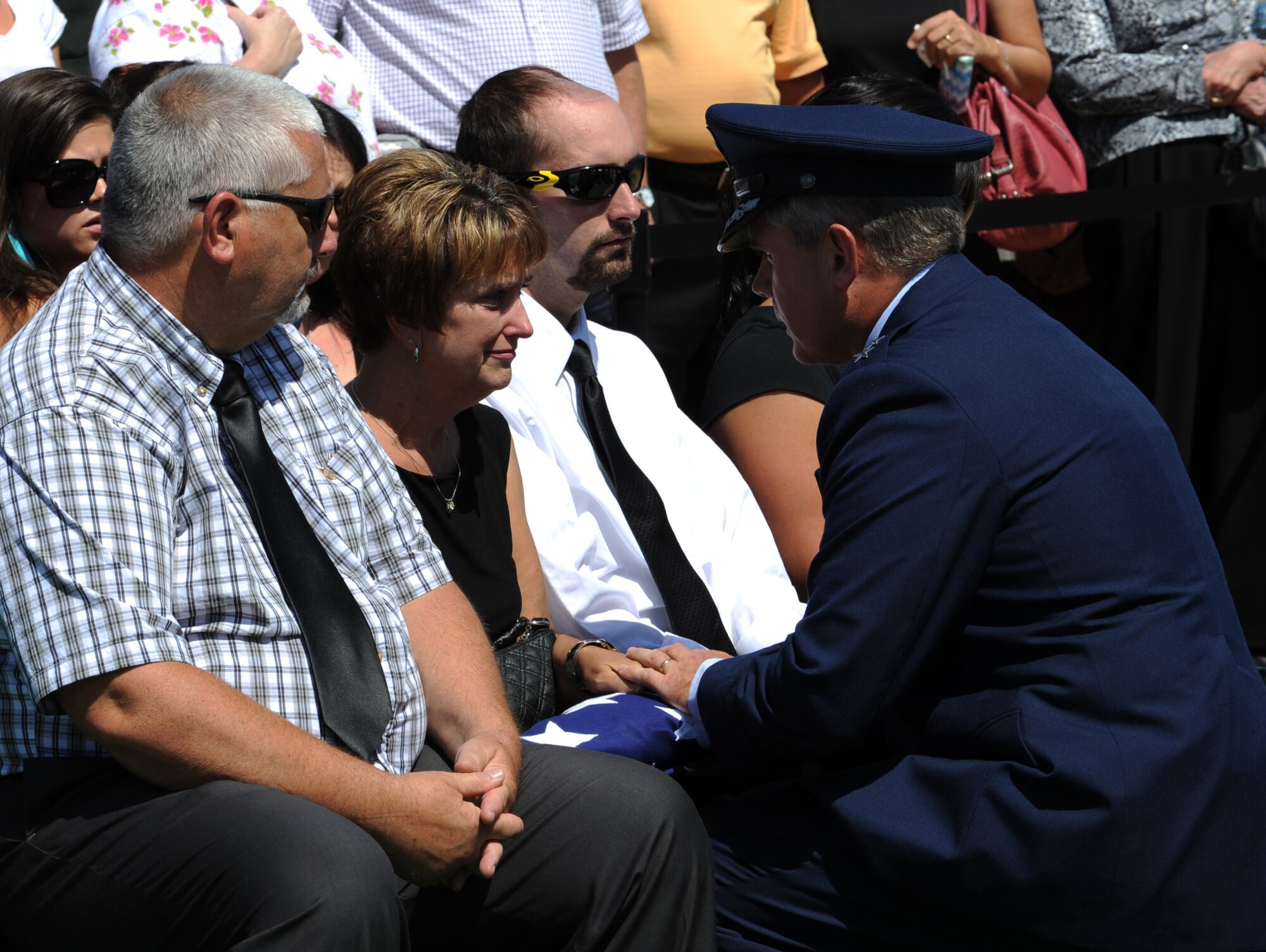 ARLINGTON NATIONAL CEMETERY, Va. Susan Zerbe is presented a flag during a funeral ceremony for her son, Technical Sgt. Daniel B. Zerbe, here Aug. 23, 2011. Zerbe was killed when a CH-47 Chinook carrying troops, crashed in the Maiden Wardak Province in eastern Afghanistan. (U.S. Air Force photo/Staff Sgt. Tiffany Trojca)