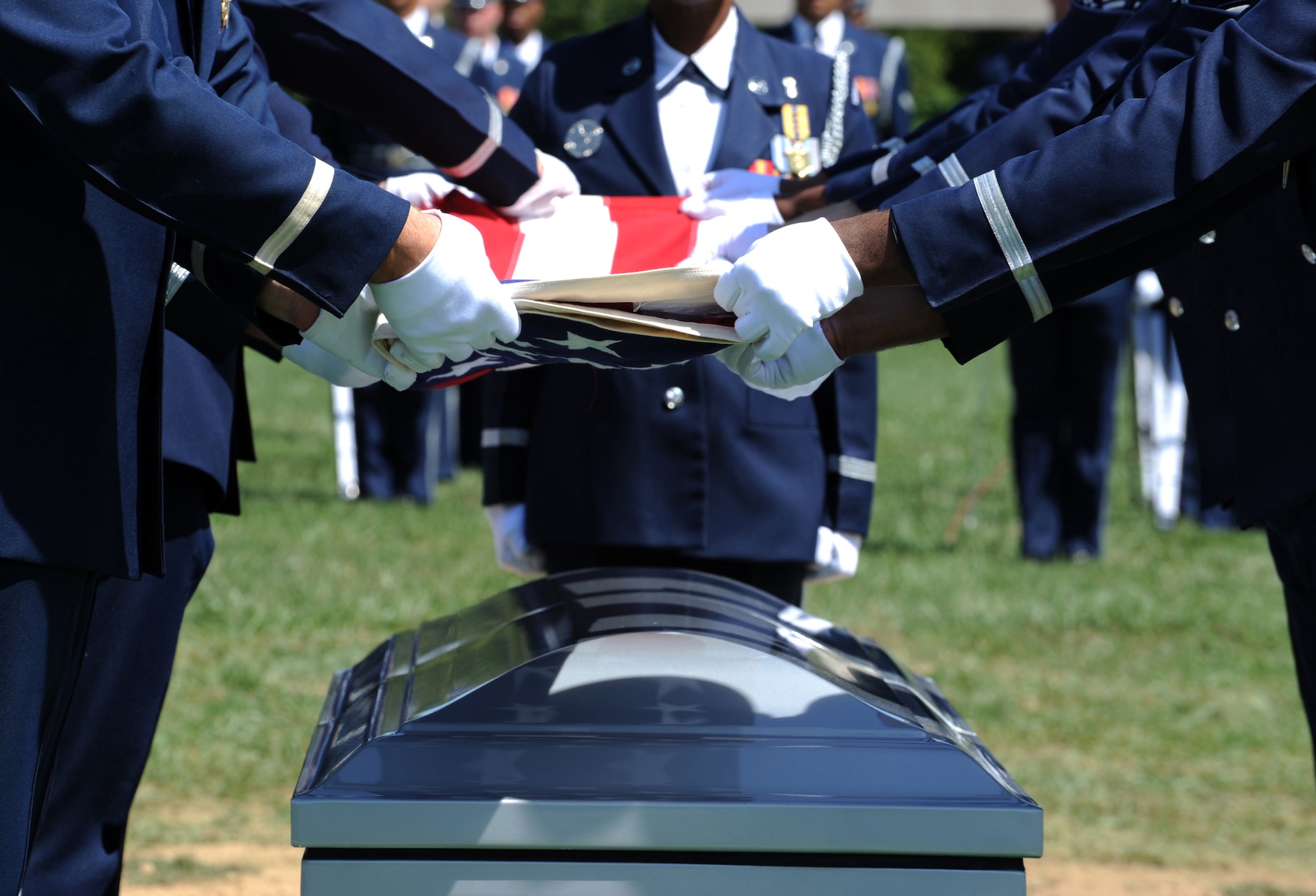 ARLINGTON NATIONAL CEMETERY, Va. -- Members of the U.S. Air Force Honor Guard fold a flag during Technical Sgt. Daniel B. Zerbe's funeral ceremony here Aug. 23, 2011. Zerbe was killed when a CH-47 Chinook carrying troops, crashed in the Maiden Wardak Province in eastern Afghanistan. (U.S. Air Force photo/Staff Sgt. Tiffany Trojca)