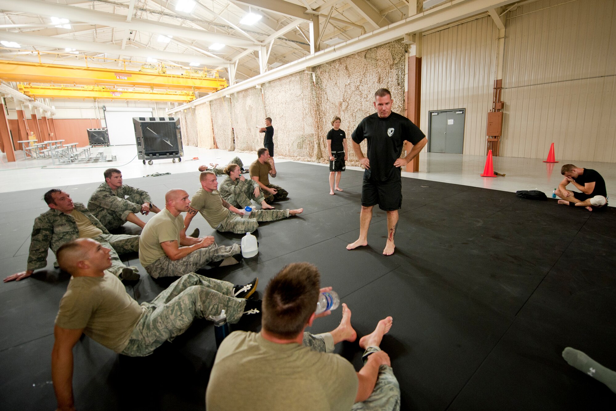 U.S. Air Force Master Sgt. Todd Cooper, 820th Combat Operations Squadron NCO in charge of operations, addresses his class during an Air Force Combatives Instructor Course at Moody Air Force Base, Ga., Aug. 23, 2011. The course was modeled after the Modern Army Combatives Program. The techniques taught within the program can be used in an offensive or defensive situation and are tailored to meet the Air Force’s needs. (U.S. Air Force photo by Staff Sgt. Jamal D. Sutter/Released)