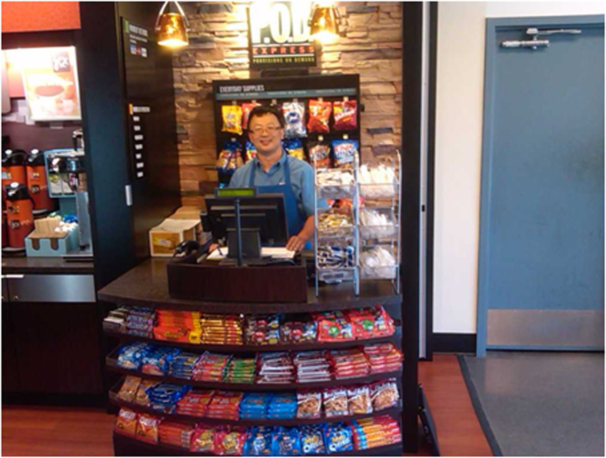 TRAVIS AIR FORCE BASE, Calif. -- The Knucklebuster Café is a food operation located in Hanger 810 that offers food items called “Provisions on Demand”. These operations were developed by Aramark to offer fresh prepared foods and snacks in a convenient location.  Menu always includes two hot Breakfast and lunch entrees (the selection rotates daily) and a wide variety of salads, sandwiches, wraps, packaged snacks, chips, nutritional bars, candy, and beverages. (U.S. Air Force courtesy photo)