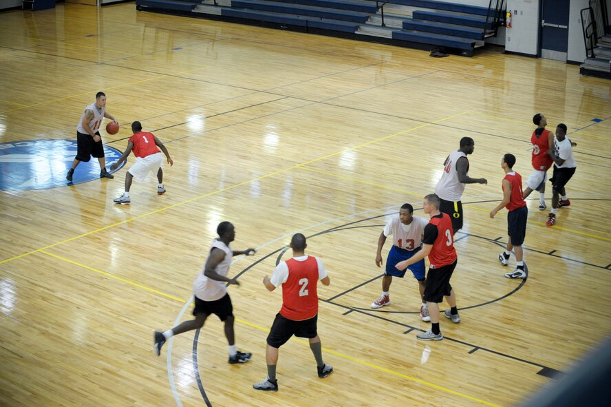 Moody Air Force Base varsity basketball team hopefuls run plays during team tryouts at the Freedom I Fitness Center, Aug. 23, 2011. The tryouts are scheduled to span over three days, giving all members who want to play on the team a chance to prove they can perform on a higher level in the sport. Members who make the team will play against other Air Force bases within the southeastern United States. (U.S. Air Force photo by Staff Sgt. Joshua J. Garcia/Released)