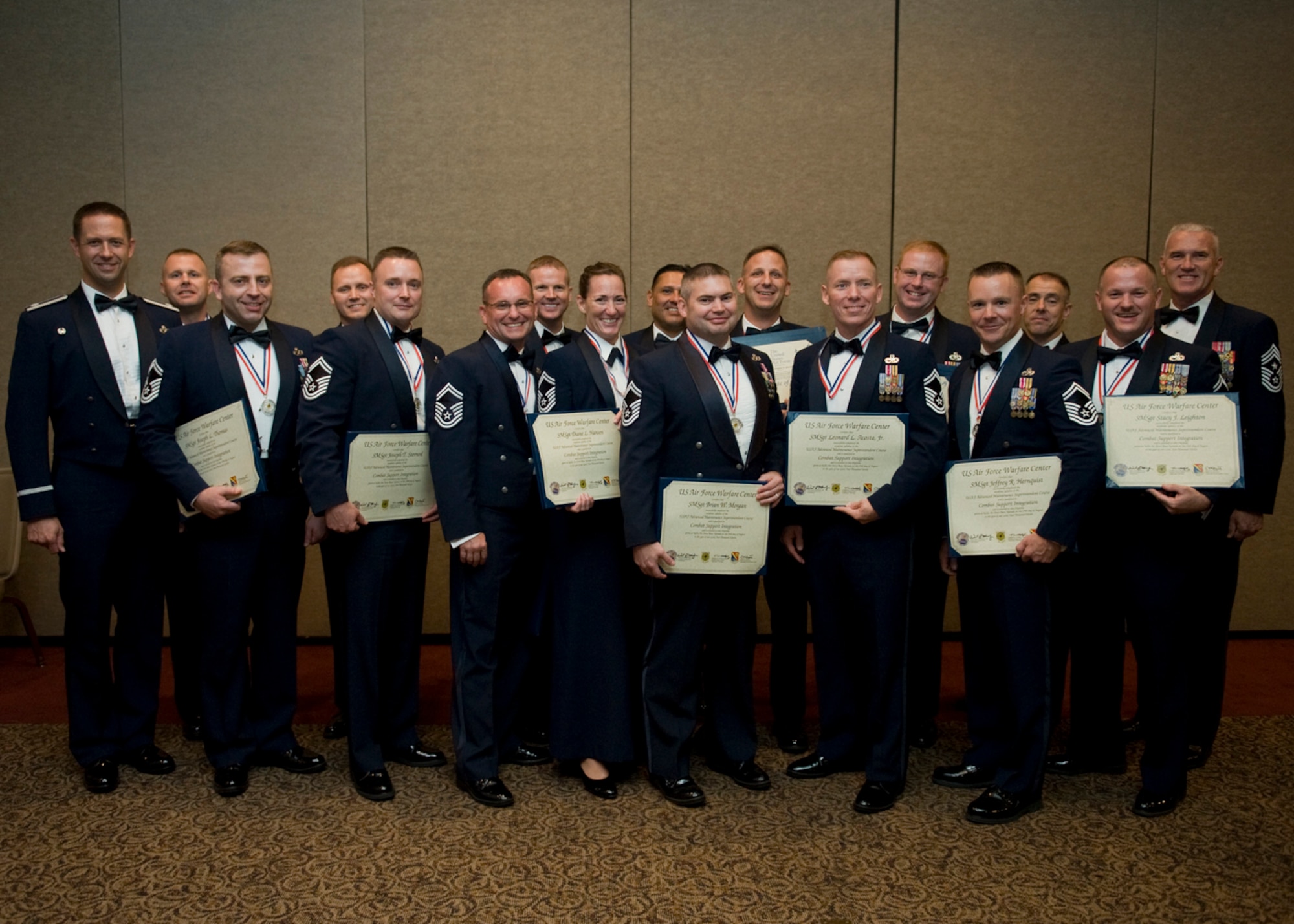 The Advanced Maintenance Superintendent Course  class 11B takes time out for a group photo after their graduation on Aug. 19, 2011, at The Club on Nellis Air Force Base, Nev. (U.S Air Force photo by Senior Airman Stephanie Rubi/Released)