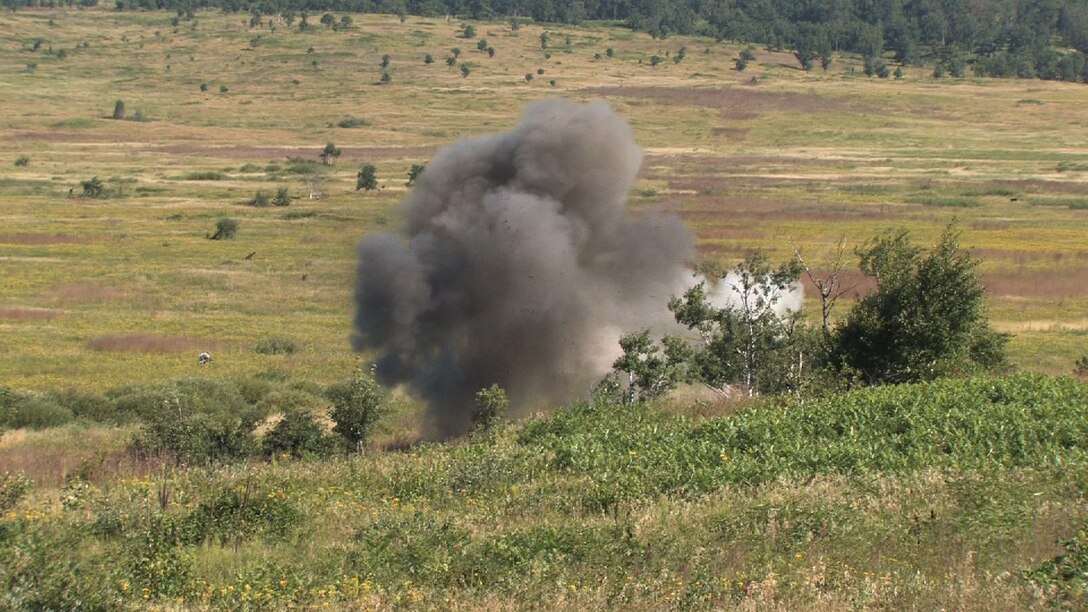 Master Sgt. Scott Castleman, Explosive Ordnance Disposal superintendent and Staff Sgt. Nathan Lentsch, EOD craftsman responded to Camp Ripley Aut. 17 to dispose of a 122mm projectile mortar round that failed to explode.  They safely detonated the device rendering it harmless. (Air Force Photo/Wendy Cormier)