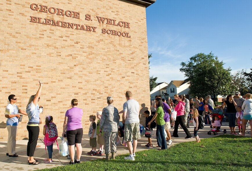 Students arrive at George S. Welch Elementary School on Dover Air Force Base, Del., for the first day of school Aug. 24, 2011.  Motorists on base are asked to keep an eye out for children walking to and from school.  (U.S. Air Force photo by Roland Balik) 