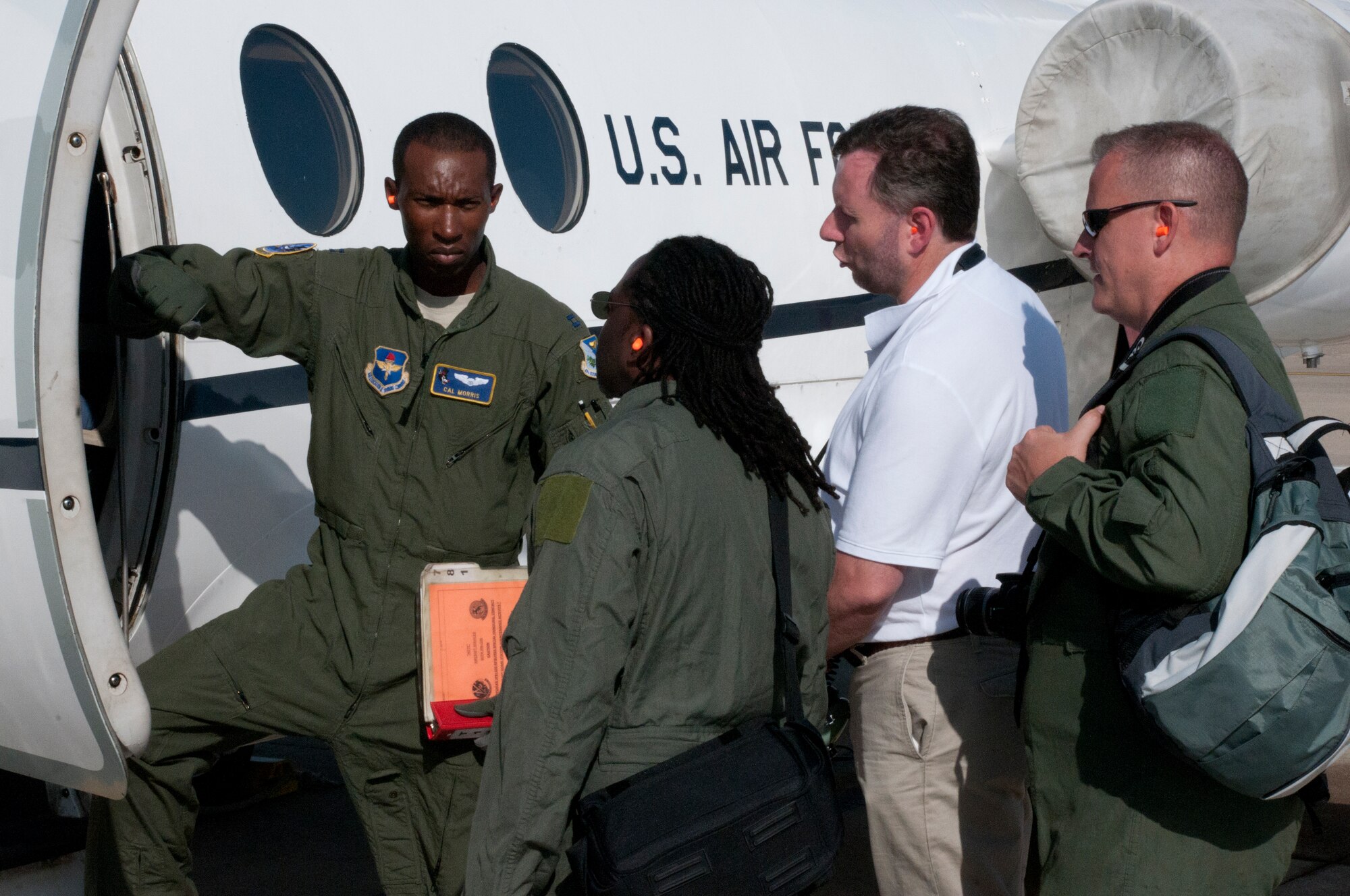 LAUGHLIN AIR FORCE BASE, TEXAS—Capt. Cal Morris, 86th Flying Training Squadron, prepares for a T-1 Jayhawk orientation flight with James Thornhill, Jim Morris and Bryan Snuffer, all artists from the Air Force Art Program. The 47th Flying Training Wing hosted the artists from Aug. 14 through Aug. 19. The artists toured Laughlin and received orientation flights in the T-6 Texan II and T-1 to help inspire them to create artwork about the mission here. (U.S. Air Force photo/Senior Airman Scott Saldukas)
