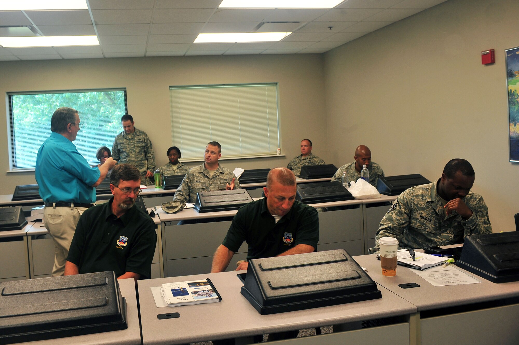 Jack Podojil, Podojil & Associates Safety and Health Experts president, instructs 9th Air Force ground safety representatives during a machine guarding safety course at the Education Center at Shaw Air Force Base, S.C. August 19, 2011. The four-day course taught the ground safety representatives how to inspect work places on their installations for safety violations to prevent mishaps that may occur while on the job. (U.S. Air Force photo by Airman 1st Class Ashley Gardner/ Released)
