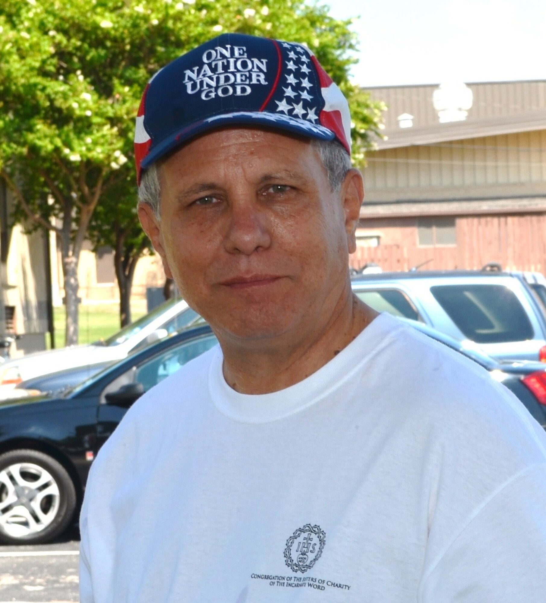 LAUGHLIN AIR FORCE BASE, Texas -- Father Tom Edelen, Laughlin priest, mingles with the Laughlin community during the Fair by the Chapel Aug. 21 that took place here. Father Edelen volunteered to move to Laughlin when he saw a need for a priest. The Laughlin Chapel has been without a full-time priest for more than 11 months. (Contributed photo)