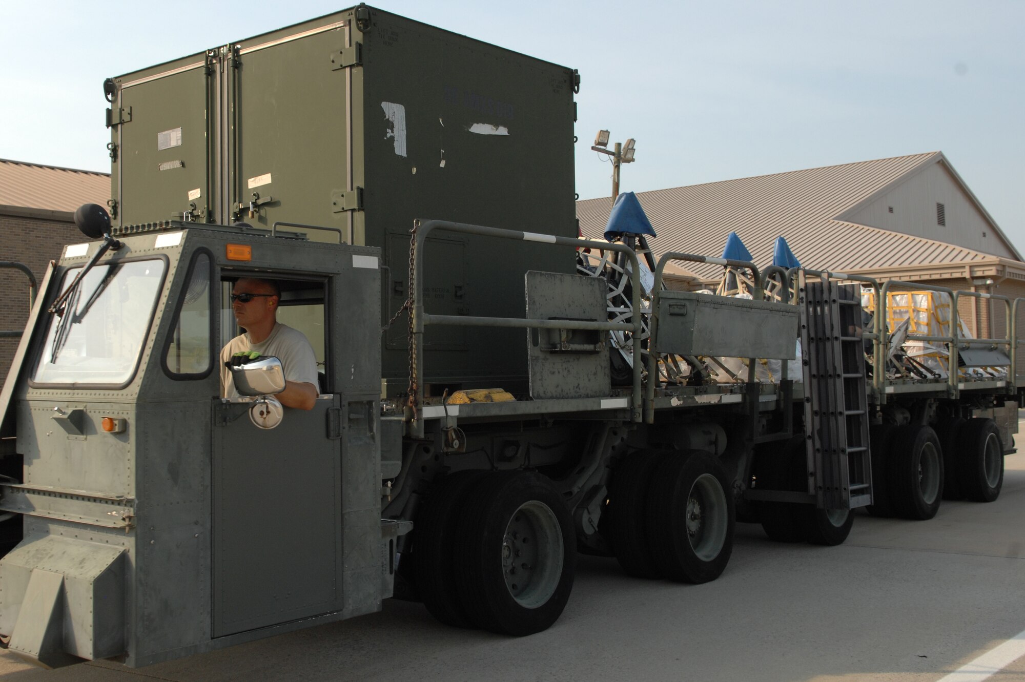 U.S. Air Force Master Sgt. Scott Host, 20th Logistics Readiness Squadron NCOIC of small air terminal, prepositions the Tunner 60K loader to upload cargo to a C-5 Galaxy on the flight line, Shaw Air Force Base, S.C., Aug. 19, 2011. Nine Airmen from the 20th LRS small air terminal worked to load up the C-5 Galaxy from Westover, Mass. with 68,000 pounds of aerospace ground equipment to support multiple F-16 Fighting Falcon flying missions around the globe.  In the middle of that task, the same maintainers off-loaded the Boeing-737 personnel, their gear and luggage. The Boeing-737 was filled with Nellis Green Flag West 11-9 returning personnel from the 55th Fighter Squadron and the 20th Aircraft Maintenance Squadron. (U.S. Air Force photo by 1st Lt. Ann Blodzinski) (Released)