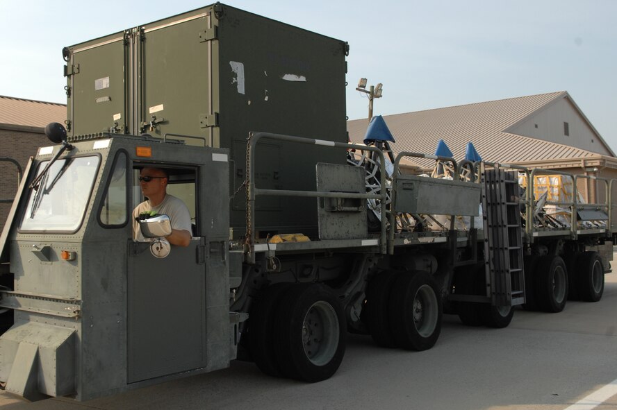 U.S. Air Force Master Sgt. Scott Host, 20th Logistics Readiness Squadron NCOIC of small air terminal, prepositions the Tunner 60K loader to upload cargo to a C-5 Galaxy on the flight line, Shaw Air Force Base, S.C., Aug. 19, 2011. Nine Airmen from the 20th LRS small air terminal worked to load up the C-5 Galaxy from Westover, Mass. with 68,000 pounds of aerospace ground equipment to support multiple F-16 Fighting Falcon flying missions around the globe.  In the middle of that task, the same maintainers off-loaded the Boeing-737 personnel, their gear and luggage. The Boeing-737 was filled with Nellis Green Flag West 11-9 returning personnel from the 55th Fighter Squadron and the 20th Aircraft Maintenance Squadron. (U.S. Air Force photo by 1st Lt. Ann Blodzinski) (Released)