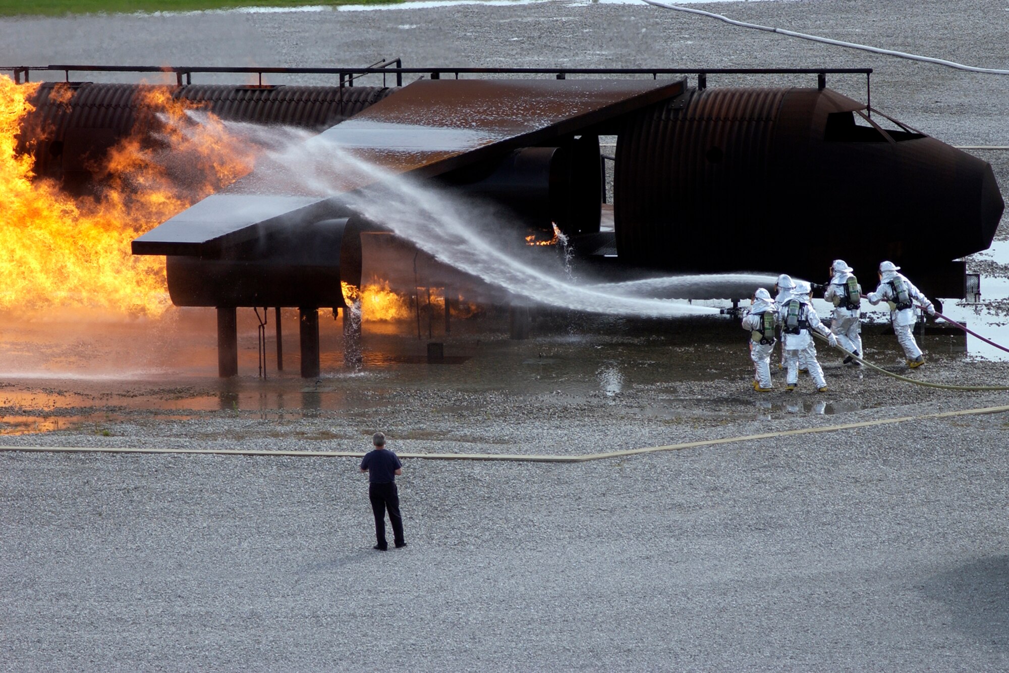GRISSOM AIR RESERVE BASE, Ind. -- Army Guardsmen from Camp Atterbury Indiana, blast water at a simulated aircraft fire during training held here. The members of the Indiana National Guard came to the base to learn how to practice responding to an incident using Grissom/s specialized mock aircraft. (U.S. Air Force photo/Tech. Sgt. Douglas Hays)