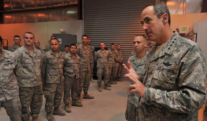 Gen. Raymond E. Johns Jr., Air Mobility Command commander, speaks with Airmen from the 8th Expeditionary Air Mobility Squadron during a visit Aug. 17 to an undisclosed location in Southwest Asia. The general, who commands nearly 136,000 active-duty and Air Reserve Component military and civilian personnel, visits the Area of Responsibility twice a year to assess current operations, receive updates and discuss future mobility operations in the theater. (U.S. Air Force photo/Senior Airman Paul Labbe)