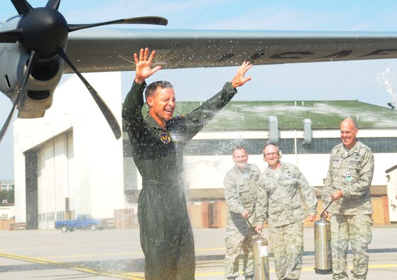 U.S. Air Force Brig. Gen. Mark Dillon, 86th Airlift Wing commander, is welcomed with a traditional spray down after his final flight, Ramstein Air Base, Germany, Aug. 24, 2011. Dillon is a command pilot with more than 3,500 flying hours. (U.S. Air Force photo/Senior Airman Brittany Perry)
