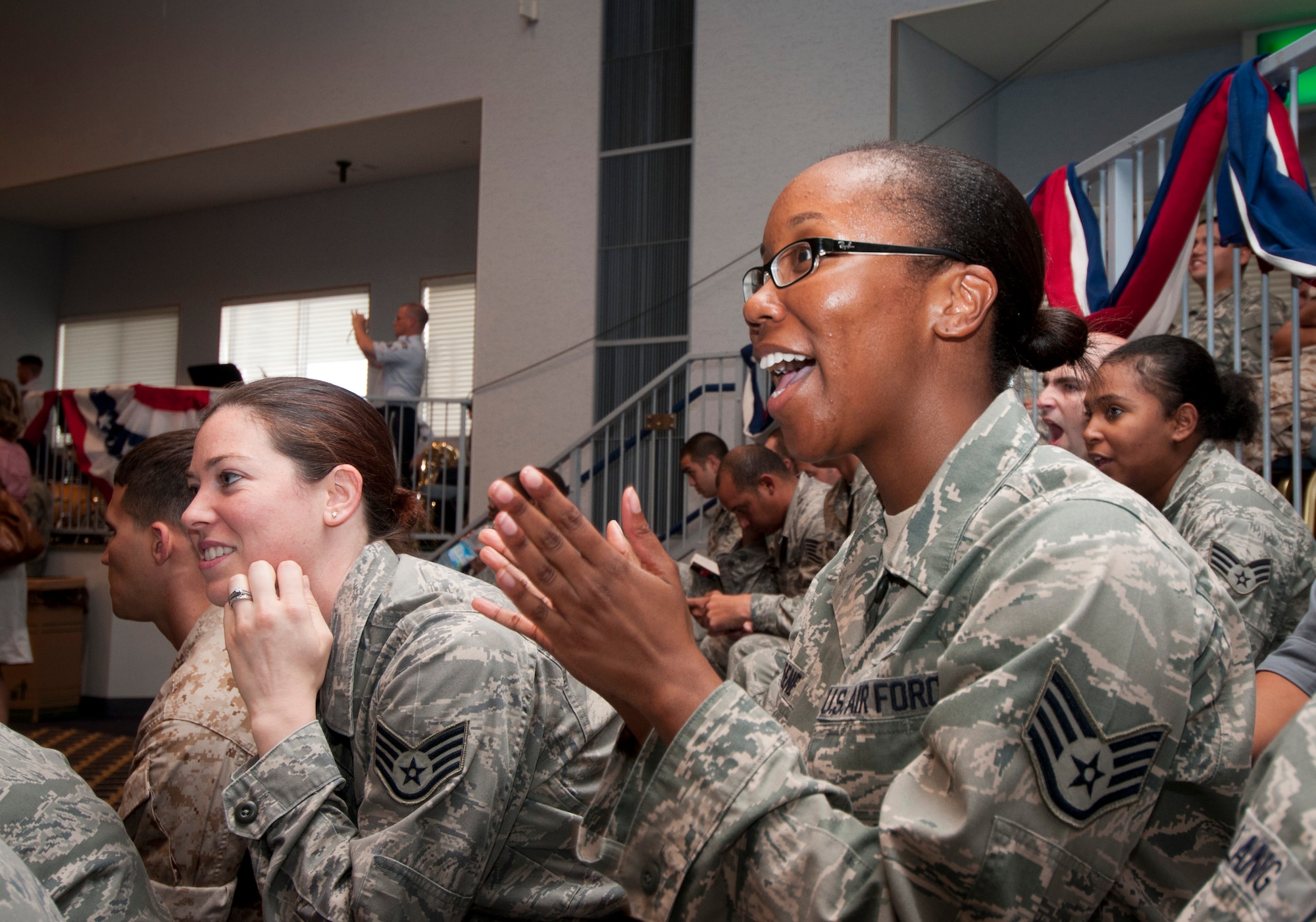 YOKOTA AIR BASE, Japan -- Staff Sgt. Alicia Greene, 374th Wing Staff Agency unit deployment monitor, cheers during Vice President Joe Biden's speech at the Taiyo Community Center, Yokota Air Base, Japan, Aug. 24, 2011. "It's really great Vice President Biden took the time to come here to thank us for all we did during Operation Tomodachi," said Sergeant Greene. (U.S. Air Force photo/Airman John D. Partlow)