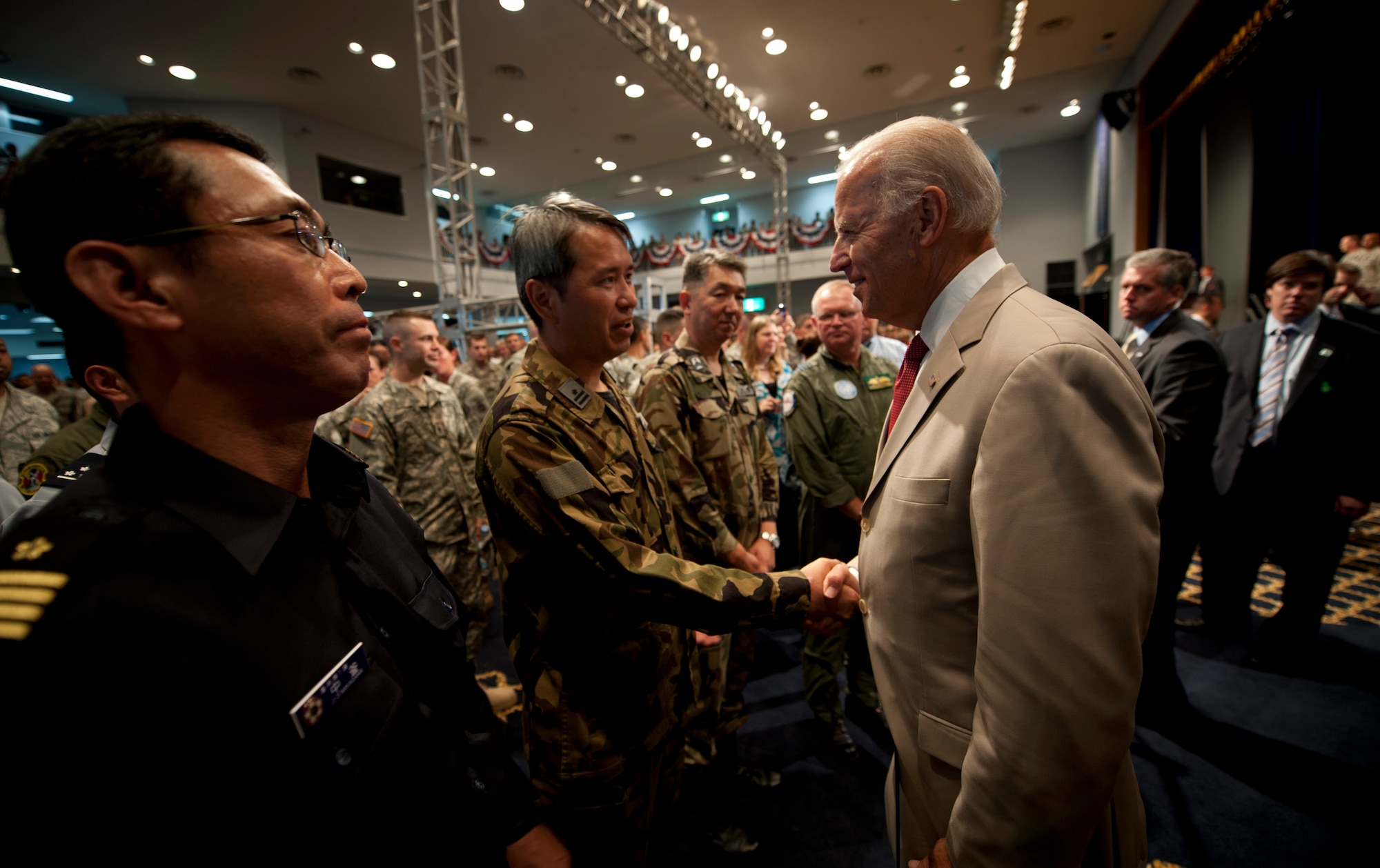 YOKOTA AIR BASE, Japan -- Vice President Joe Biden shakes hands with Japan Self-Defense Force members Aug. 24, 2011, at the Taiyo Community Center, Yokota Air Base, Japan. As part of a nine-day tour of Asia, the Vice President visited Japan to express dedication to steadfast U.S. support following the Tohoku earthquake earlier this year. (U.S. Air Force photo/Staff Sgt. Samuel Morse)