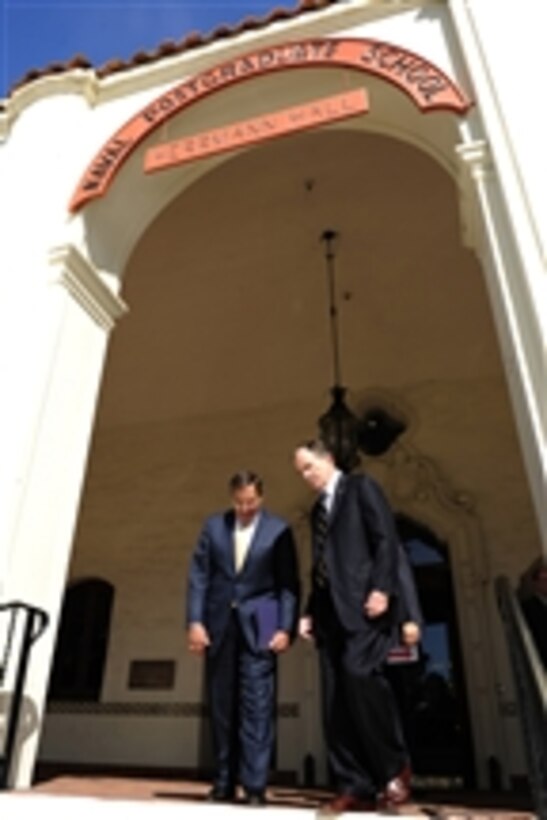 Defense Secretary Leon E. Panetta walks with Daniel T. Oliver, president of the Naval Postgraduate School at Monterey, Calif., on Aug. 23, 2011.
