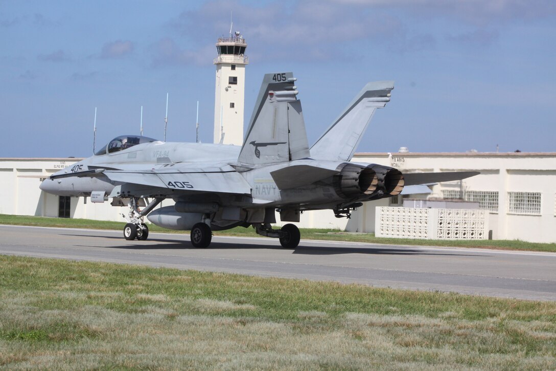 Navy Lt. Cmdr. Robert Lanane, Strike Fighter Attack Squadron 94 mainteneance officer, taxi's to the take off point during exercise Habu Fire 2. Lanane performed a ordnance operation where practice ordnance was dropped. Habu Fire 2 is a joint-training exercise where Marines, Navy and Air Force work together to learn and teach new techniques.