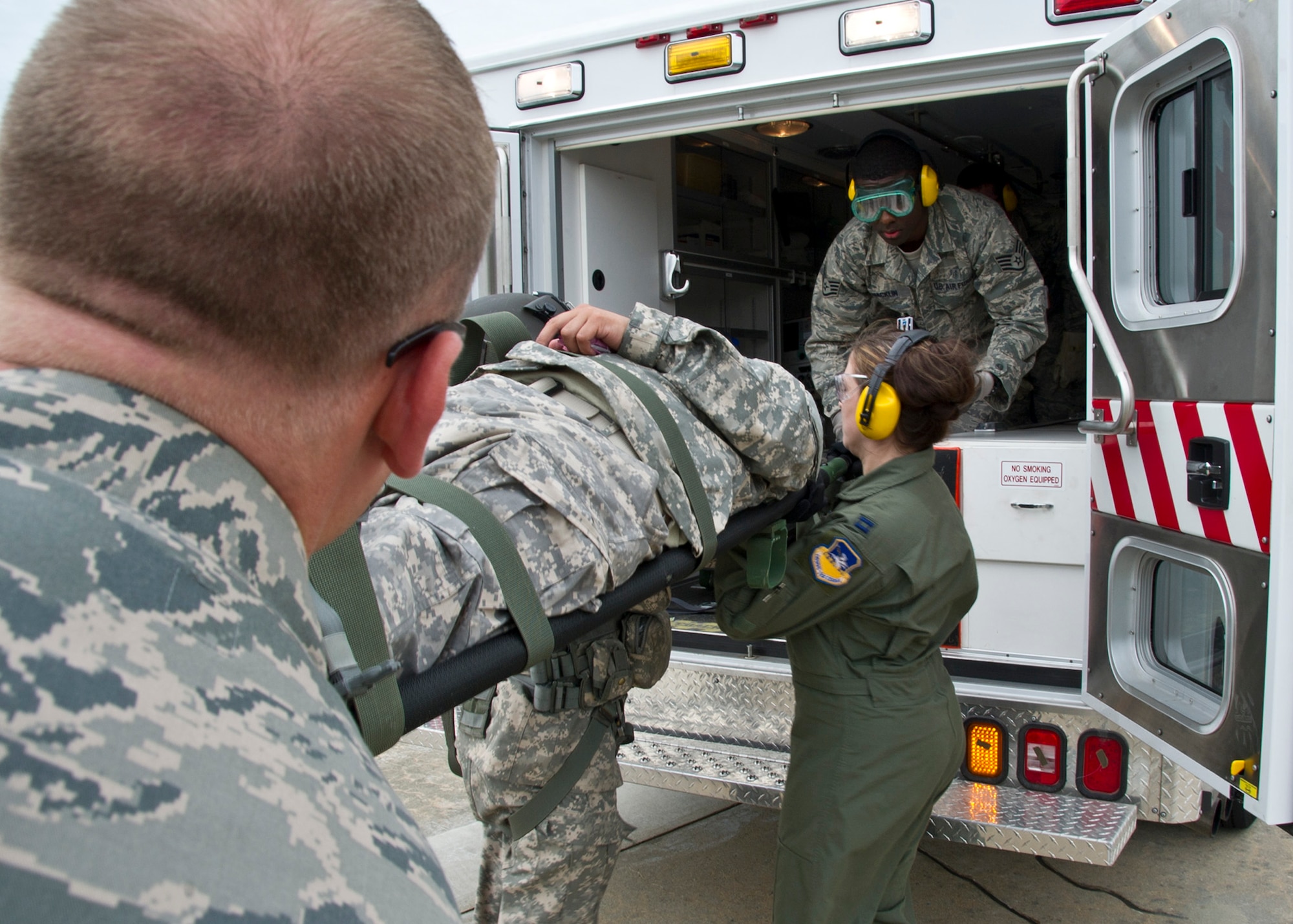 Members from the 51st Medical Group field response team transport a casualty from a UH-60 Black Hawk to an ambulance during Dragon Lift, Aug. 24, 2011. Afterward, the patient was transported to the patient staging area to be safely unloaded and treated. (U.S. Air Force photo/Senior Airman Adam Grant)