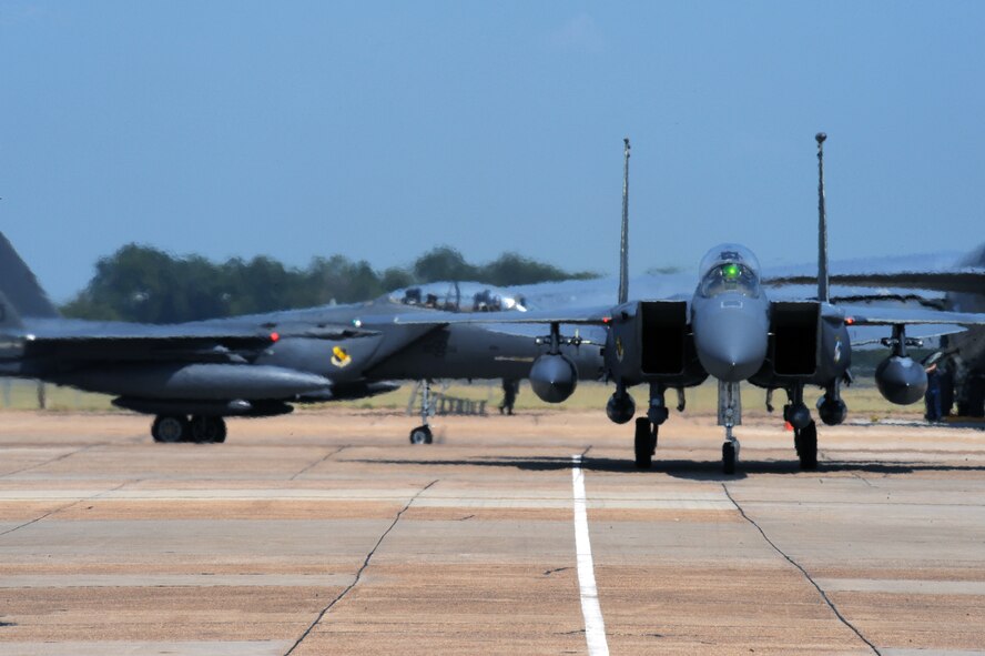 F-15E Strike Eagles taxi down the ramp at Barksdale Air Force Base, La., Aug. 25. F-15Es and KC-135R Stratotankers evacuated from Seymour Johnson Air Force Base, N.C., due to a hurricane projected to hit the East coast over the next few days. (U.S. Air Force photo/Airman 1st Class Micaiah Anthony)(RELEASED)