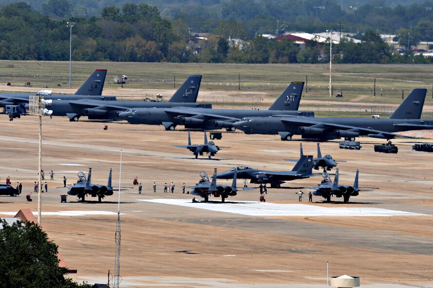 F-15E Strike Eagles taxi down the ramp at Barksdale Air Force Base, La., Aug. 25. F-15Es, KC-135R Stratotankers and their ground crew evacuated from Seymour Johnson Air Force Base, N.C., due to a hurricane projected to hit the East coast over the next few days. (U.S. Air Force photo/Airman 1st Class Micaiah Anthony)(RELEASED)