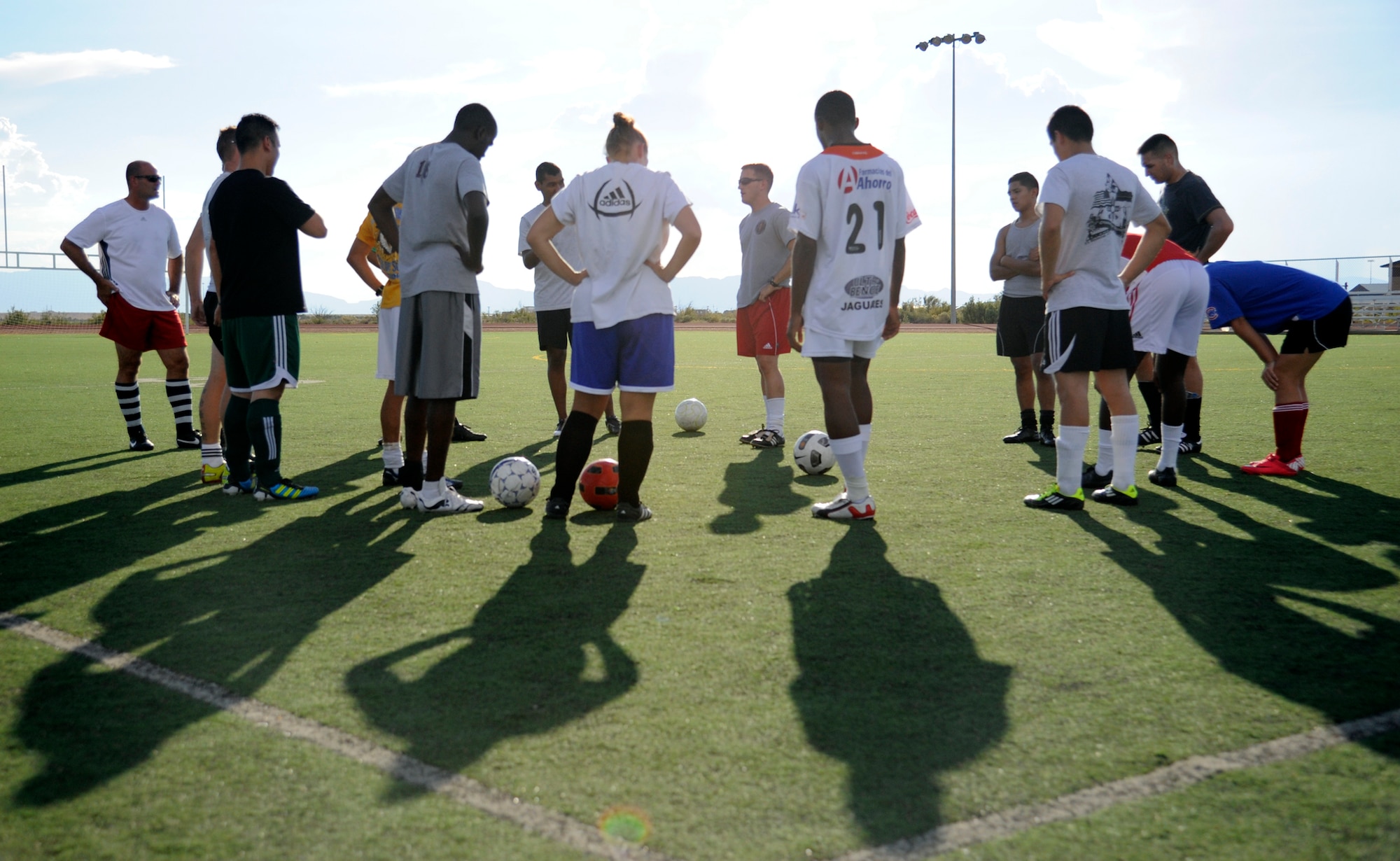 HOLLOMAN AIR FORCE BASE, N.M. -- Members of the Holloman Varsity Soccer Team discuss the details of a drill Aug. 22, 2011, during a team practice at the turf field outside of the Holloman fitness center. The team is made up of military members from around the base, dependents and members of the German air force. (U.S. Air Force photo by Airman 1st Class Siuta B. Ika/Released)