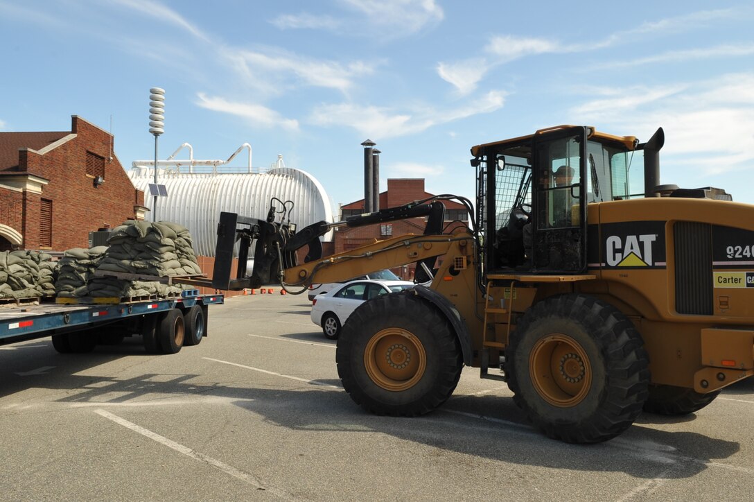Airmen from the 633rd Civil Engineer squadron deliver sandbags to various buildings in an effort to prevent flooding during Hurricane Irene at Langley Air Force Base, Va., Aug. 25, 2011. Langley AFB is preparing for the hurricane, which is expected to make landfall in the area on early Sunday morning. (U.S. Air Force photo by Staff Sgt. Logan Tuttle/released)
