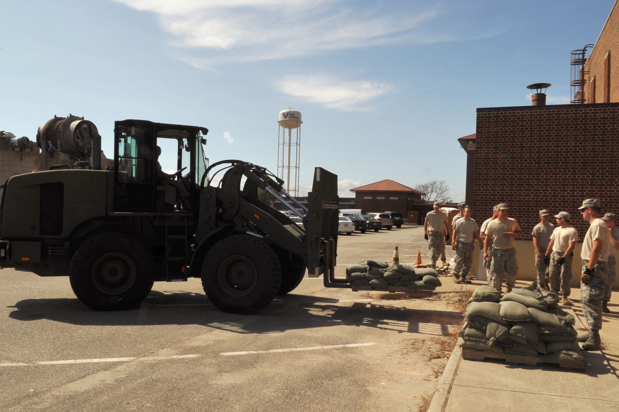 Airmen from the 633rd Civil Engineer Squadron palletize sandbags to transport to various buildings across Langley Air Force Base, Va., Aug. 25, 2011. Langley AFB is preparing for Hurricane Irene, which is expected to make landfall in the area on early Sunday morning. (U.S. Air Force photo by Staff Sgt. Logan Tuttle/released)