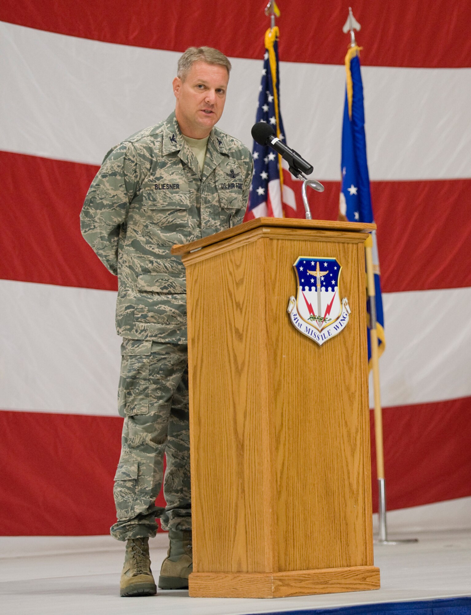 Col. David Bliesner speaks to an audience after assuming command of the 341st Maintenance Group June 29 in the 3-Bay Hangar. (U.S. Air Force photo/Beau Wade)