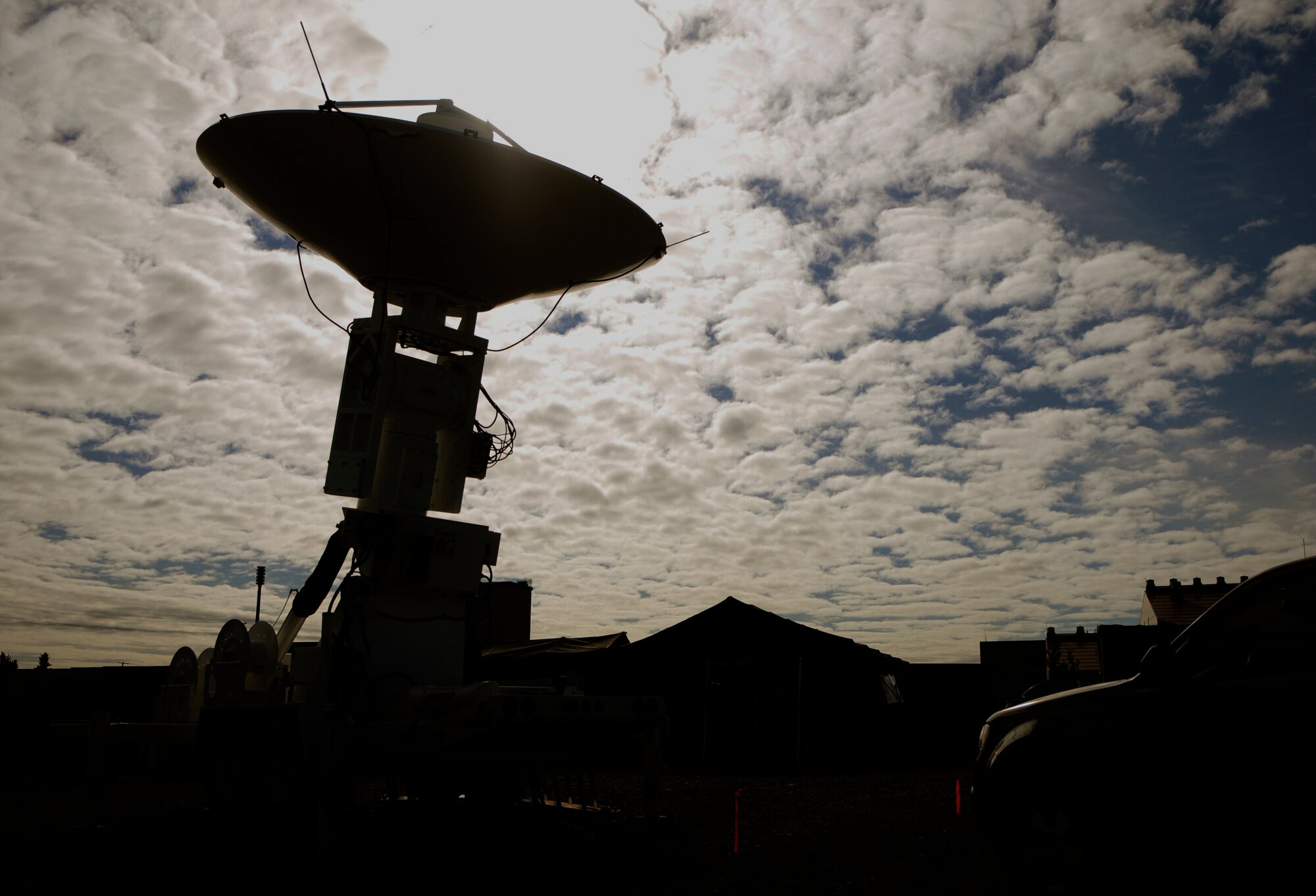 An Eagle Vision 5 antenna downloads raw data to be processed by the Eagle Vision 5 team Aug. 16, 2011, Eielson Air Force Base, Alaska.  The mobile satellite ground station can directly link to a number of multi-national satellites to stream unclassified satellite imagery that can be processed and shared with first responders and war fighters.  (U.S. photo by/Airman 1st Class Yash Rojas)

