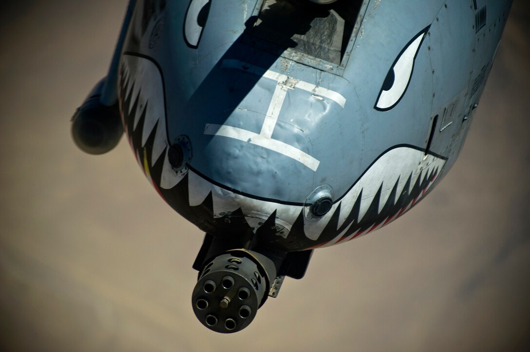 An A-10 Thunderbolt II is refueled Aug. 18, 2011, over Southern Afghanistan. The most prominent feature of the A-10 Thunderbolt II is the 30 mm GAU-8/A Avenger Gatling-gun cannon. This weapon is capable of firing 3,900 rounds a minute and can defeat an array of ground targets, including tanks. (U.S. Air Force photo/Master Sgt. Jeffrey Allen)