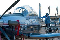 LAUGHLIN AIR FORCE BASE, Texas – Rogelio Rodriguez, T-6 Texan II crew chief, wipes down the tail of a T-6 before its flight here Aug. 25. (U.S. Air Force photo/Senior Airman Scott Saldukas) 